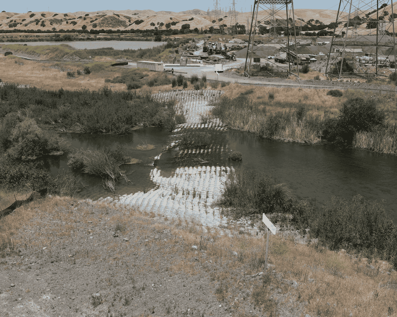 The current remaining barrier is created by a major gas pipeline in Sunol Valley upstream (or south) of the Interstate 680 overpass.
