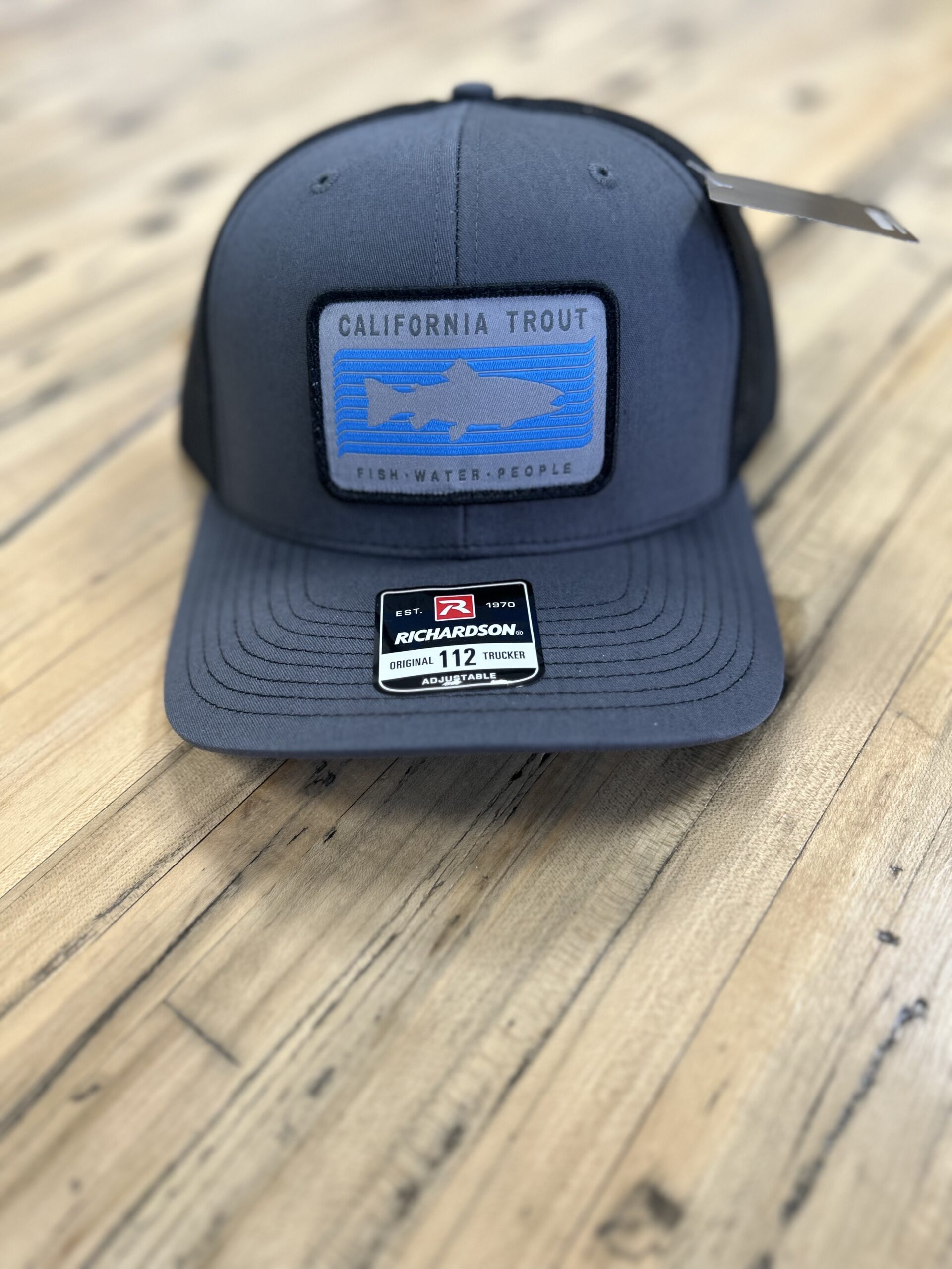 CalTrout Trucker Hat – Charcoal/Black with Woven Patch